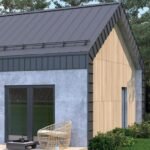 Modernus namas su pilka stogo lietaus nuvedimo sistema.